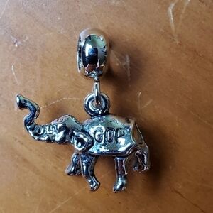 NWOT charm, silver colored elephant with GOP on each side